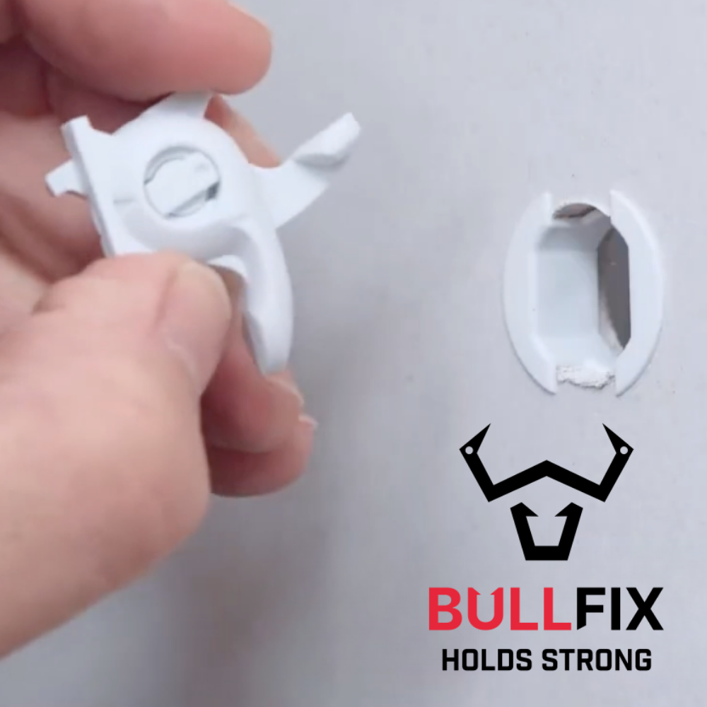 a hand holds a Bullfix universal fixing next to the hole in the wall that has the bullfix collar already installed in it. Bullfix logo