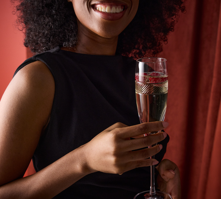 women celebrating using RD champagne flute