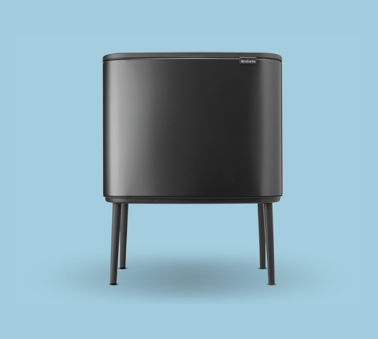 Picture of a black bin on a bright blue background