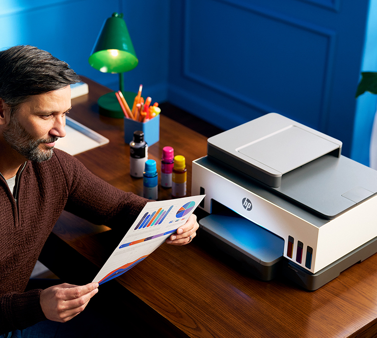 Girl printing from phone to HP Printer on desk