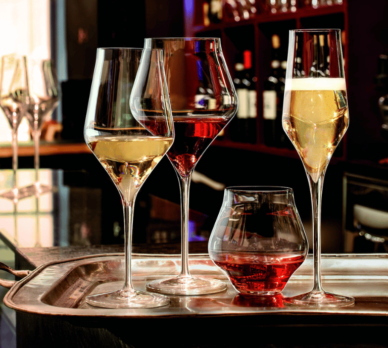Image showing Luigi Bormioli Glassware on a Table at a Party with Canopies to the side.