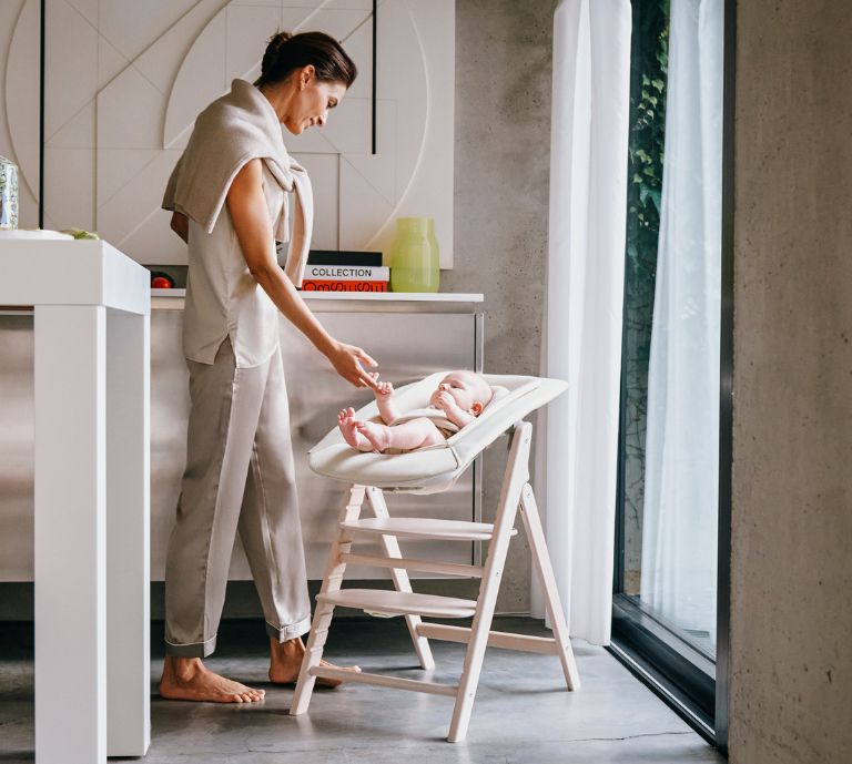 Click & Fold highchair with bouncer nest attached to highchair legs