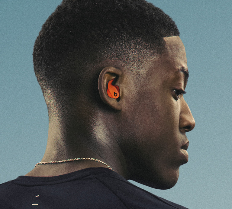 Image of the man wearing powerbeats fit earphones