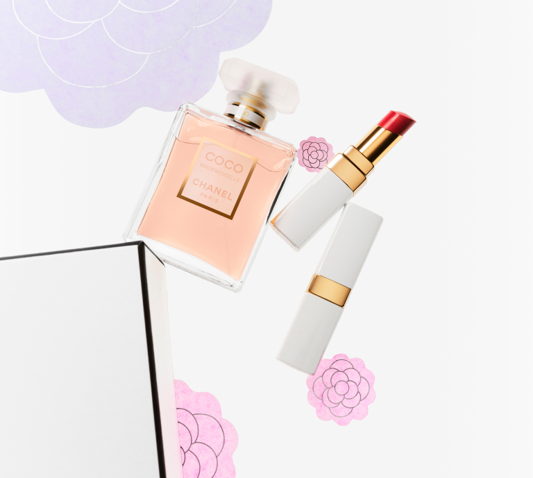 Image of Chanel fragrance and lipstick against floral background