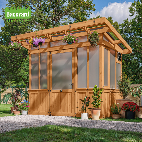 Greenhouse in garden setting with Backyard Discovery logo