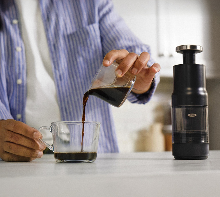 oxo rapid brewer with a cup on the table