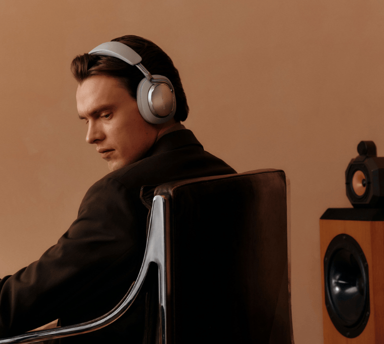 Model wearing the new Px8 S2 Wireless headphone in Pearl Blue from Bowers & Wilkins