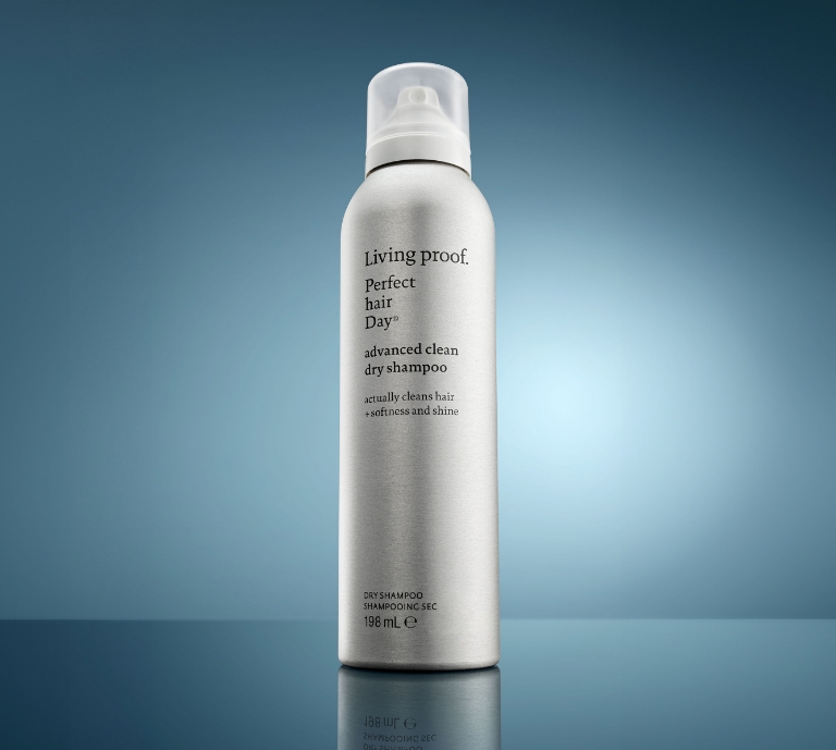 Image showing a silver can of Living proof dry shampoo on a dark blue background