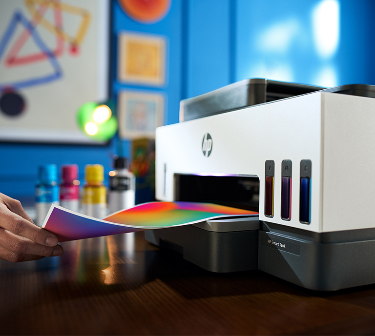 HP printer on desk with printing images 