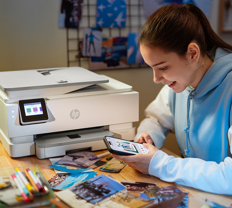 HP printer on desk with Femail printing images from their mobile phone