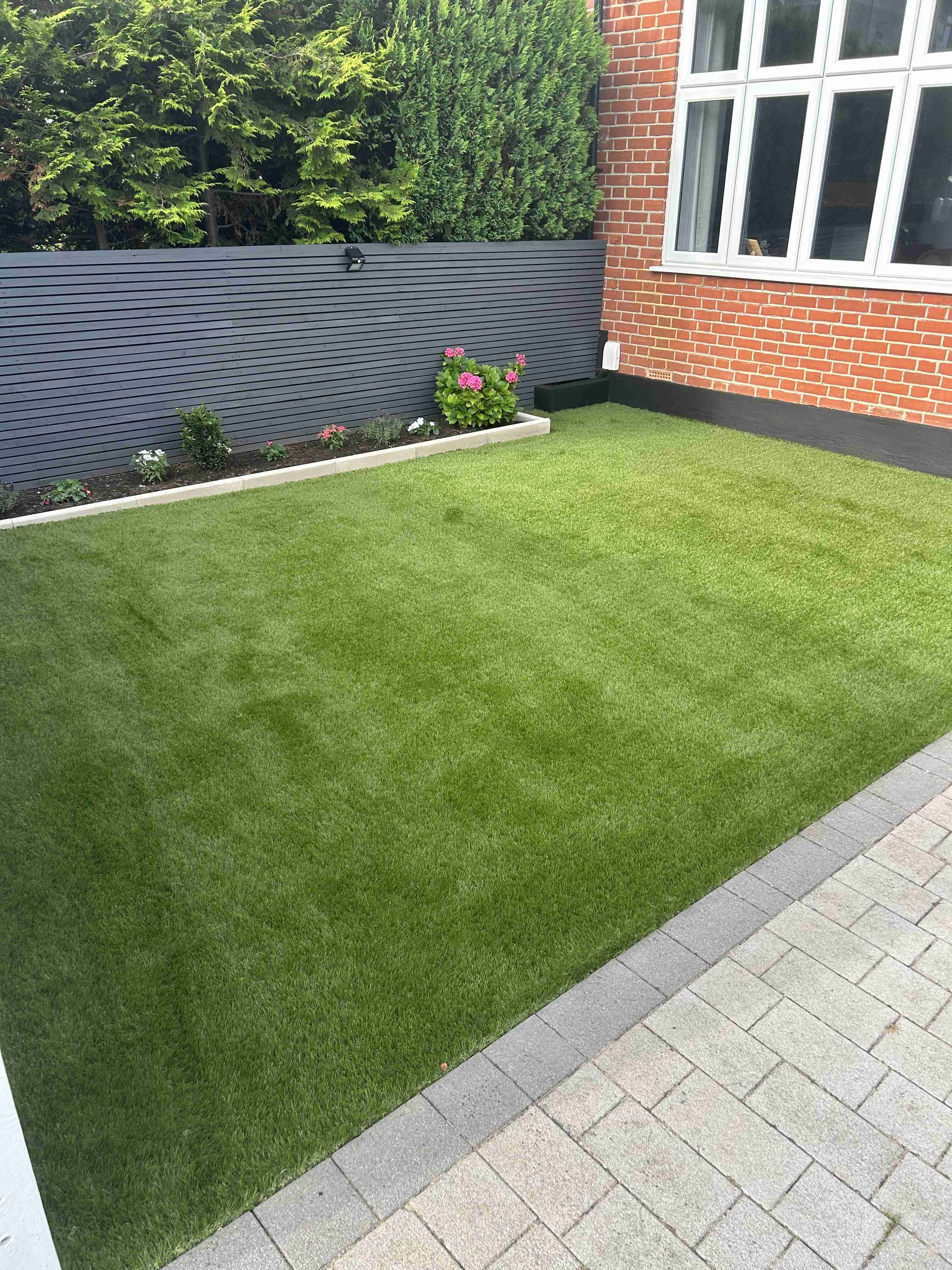 Sponsored banner for soft & realistic artificial grass rolls. Shop now button