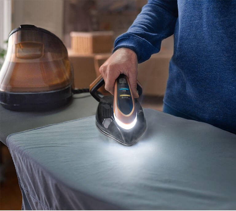 An advertisement showing Tefal Pro Express Vision Steam Generator Iron