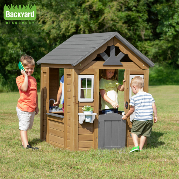 Backyard Discovery Maple Leaf playhouse in a garden setting