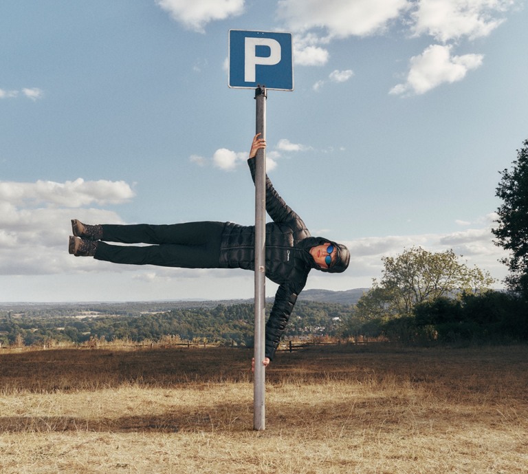 Model sideways on a lamp post, showcasing product